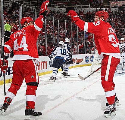 Todd Bertuzzi (44) and Johan Franzen celebrate one of the Red Wings' seven goals against the Jets. (Getty Images)