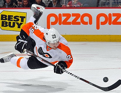 Despite getting tripped up, rookie Harry Zolnierczyk manages to score his second goal of the season. (Getty Images)