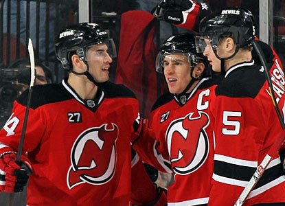 After setting up three goals for New Jersey, Zach Parise (center) gets to celebrate a goal of his own. (Getty Images)