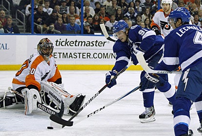 Steven Stamkos, who earns one of the stars of the game, nets at least two goals in a game for the fifth time this season. (AP)