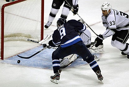 Evander Kane makes the home fans erupt when he scores this goal 69 seconds into overtime. (AP)