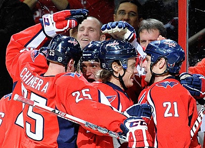 Alexander Ovechkin, who scores two goals in a game for only the third time this season, is mobbed by teammates. (Getty Images)