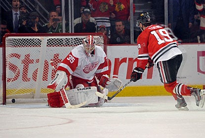 After being hooked, Jonathan Toews converts a penalty shot -- the second try of his career. (US Presswire)