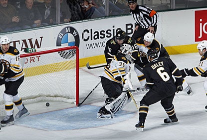 Trevor Daley knocks in a rebound past Tim Thomas for his fourth goal and also helps set up two other Dallas goals. (Getty Images)