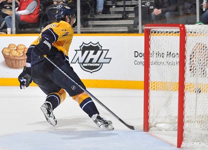 Sergei Kostitsyn adds an empty-netter to complete his hat trick. (Getty Images)