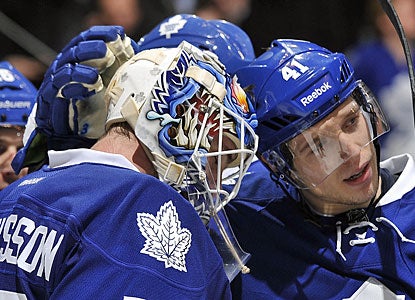 Nikolai Kulemin (right), who scores a goal, congratulates Jonas Gustavsson for his second shutout in three starts. (Getty Images)