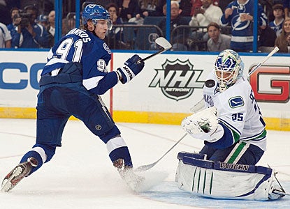 Cory Schneider turns away all three shots in the shootout, including the one by Steven Stamkos. (Getty Images)