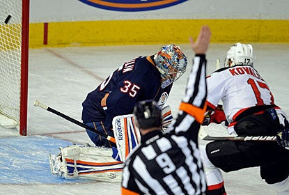 Ilya Kovalchuk scores on Nikolai Khabibulin in a short-handed situation for his 17th goal of the season. (AP)