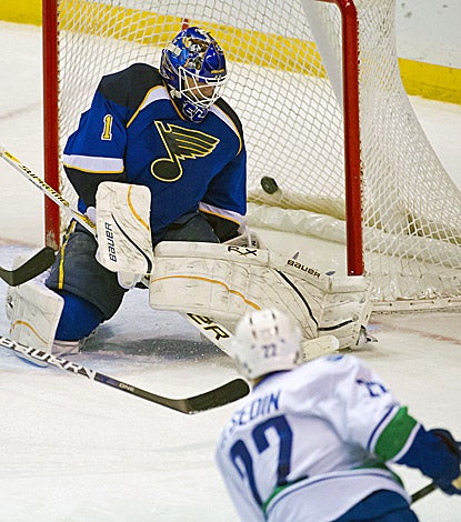 Vancouver's Daniel Sedin fires the winning goal past St. Louis goalkeeper Brian Elliott 46 seconds into overtime. (US Presswire)