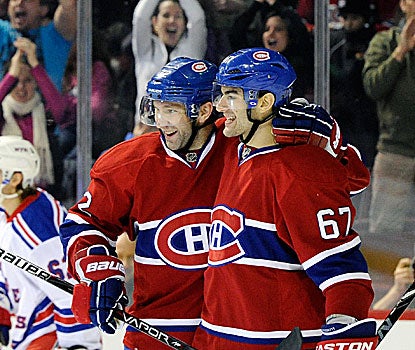 Erik Cole (left) and Max Pacioretty combine for two goals and four assists in the Canadiens' win.  (Getty Images)