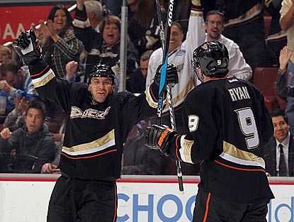 Francois Beauchemin (left) celebrates a first-period goal with Bobby Ryan. The goal gives Anaheim a 2-1 lead.  (Getty Images)