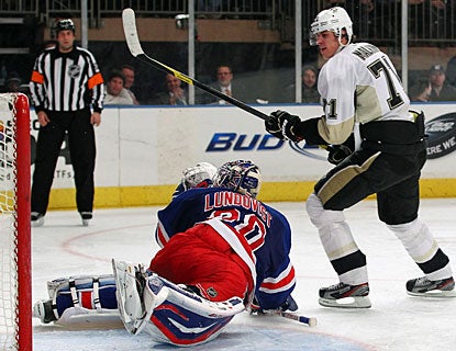 Evgeni Malkin takes advantage of a turnover to beat Henrik Lundqvist. Malkin later adds an empty-netter as well. (Getty Images)