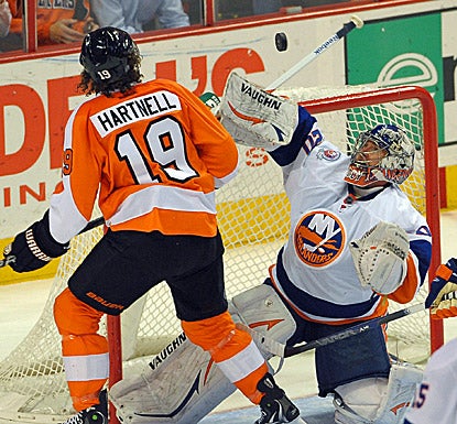 New York goalie Evgeni Nabokov (right) makes one of his 40 saves against Philadelphia during the Islanders' 4-1 win. (US Presswire)