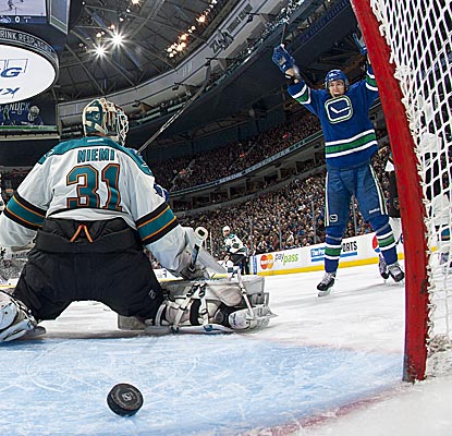 The Canucks' David Booth adds an assist to go with this deflected goal, his sixth of the season.  (Getty Images)