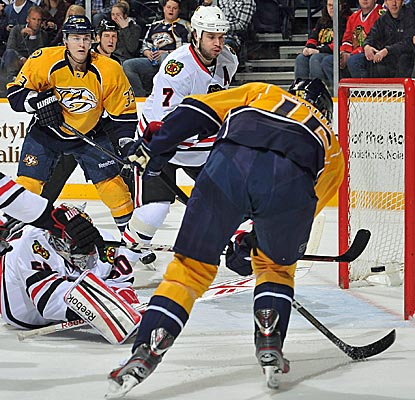 Craig Smith angles one of Nashville's five goals past Chicago goaltender Corey Crawford.  (Getty Images)