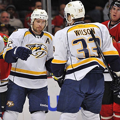 Mike Fisher (left) and Colin Wilson score two of the Predators' three goals in their victory over the Blackhawks.  (US Presswire)