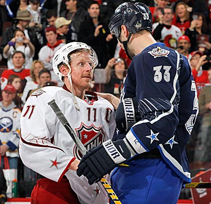 Captains Daniel Alfredsson (11) and Zdeno Chara have a short (and tall) visit after the game.  (Getty Images)