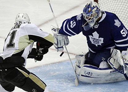 Evgeni Malkin ties the game with six seconds left in regulation, then scores the winner in the shootout.  (AP)