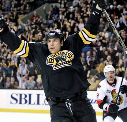 Milan Lucic finds the back of the net with 45 seconds left in the second period for the victorious Bruins.  (AP)