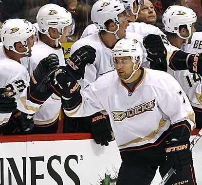 The Anaheim bench appreciates the third goal in a row scored by Andrew Cogliano in the second period. (AP)