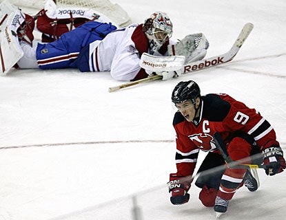 A beaten Carey Price watches Zach Parise enjoy his third-period goal, his second in the game. (AP)