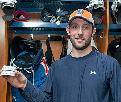 Sam Gagner shows off the souvenirs he earned from registering eight points in a span of 34 minutes.  (Getty Images)