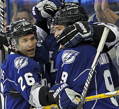 It's a good all-around day for Martin St. Louis (26), who records his fifth career hat trick -- first since 2006. (AP)