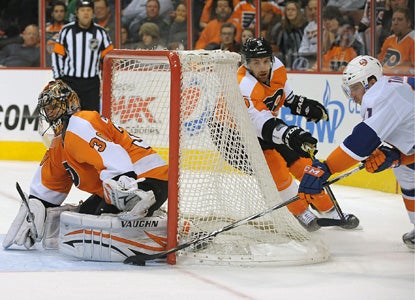 John Tavares is turned away here but gets the last laugh in the shootout, scoring to help the Isles edge the Flyers. (Getty Images)