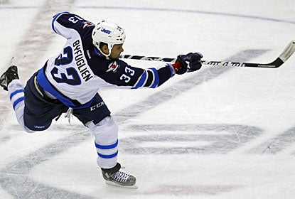Dustin Byfuglien scores the tying goal on this uncontested shot from some 82 feet (red line) away. (US Presswire)