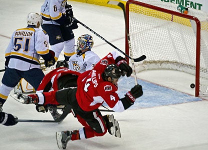 Chris Phillips (4) gets to celebrate his 1,000th NHL game with two goals -- his first in 75 games. (US Presswire)