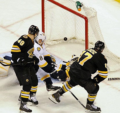 With only 67 seconds to play in regulation, Milan Lucic (17) finds the back of the net to tie the game at 3-3. (US Presswire)