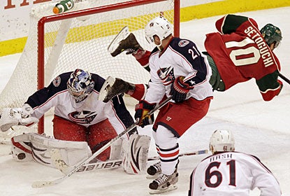 James Wisniewski (21), who missed 17 games with an ankle injury, makes a defensive play in front of his goaltender. (AP)
