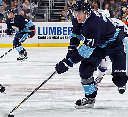 The Pens' Evgeni Malkin scores two goals to increase his league-leading point total to 69.  (Getty Images)