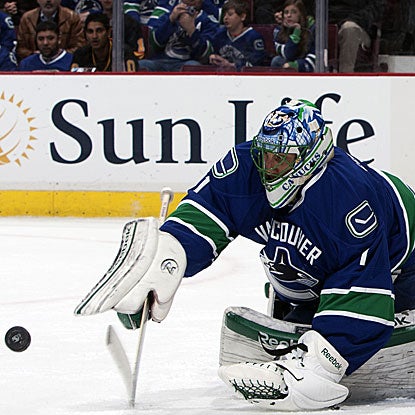 The Canucks' Roberto Luongo allows one goal and stops 23 shots in regulation and overtime to force a shootout.  (Getty Images)