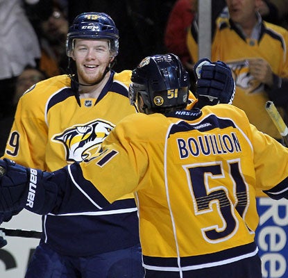 Nashville's Ryan Ellis celebrates the game-winning goal against Chicago with teammate Francis Bouillon. (Getty Images)