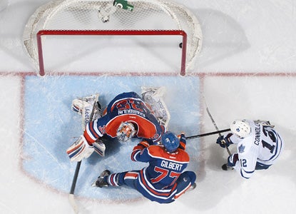 Tim Connolly (right) scores in overtime to give the Maple Leafs the win over the Oilers. (Getty Images)