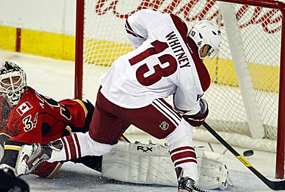 The Coyotes' Ray Whitney scores the tying goal, then also scores the winning goal in a shootout victory over the Flames. (AP)
