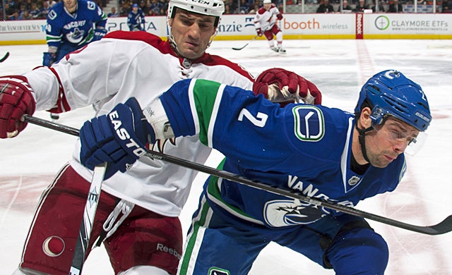Dan Hamhuis and the rest of the Canucks' defense is failing to help the offense move the puck. (Getty Images)