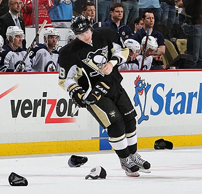 Pittsburgh fans appreciate James Neal's second career hat trick by throwing hats on the ice. (Getty Images)