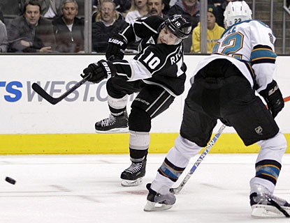 Mike Richards matches his teammate Anze Kopitar with one goal and two assists each against San Jose. (AP)