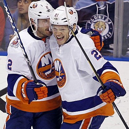 The Islanders' Kyle Okposo (right) scores in the third period after his pass gets deflected into the Panthers' goal.    (AP)