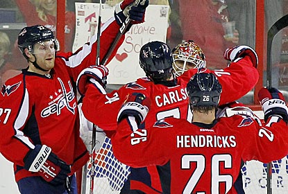 Capitals goalie Braden Holtby is congratulated after holding off a late power play to preserve a shutout.  (US Presswire)