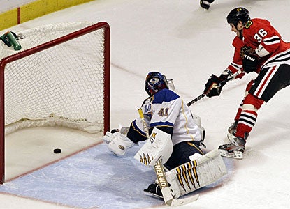 Dave Bolland beats Jaroslav Halak with the only goal in the shootout to give Chicago the win. (AP)
