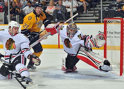 Corey Crawford makes one of his 29 saves to help Chicago beat Nashville for the first time this season. (Getty Images)