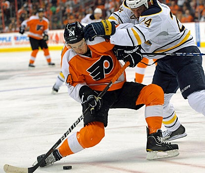 The Sabres push Matt Read around, but the Flyers' forward scores the game-winning goal for the Flyers. (US Presswire)