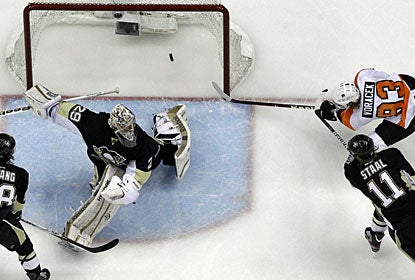 Jakub Voracek collects a rebound and completes an impressive comeback by Philadelphia against Pittsburgh. (AP)