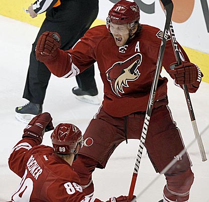 The Coyotes' Martin Hanzal celebrates his game-winning goal as Phoenix retains home ice with an overtime win.  (AP)