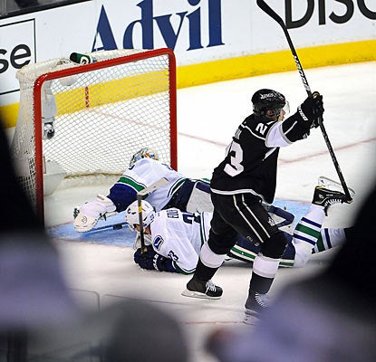 The Kings score in the third period off a Dustin Brown goal, which helps L.A. move one game away from stunning Vancouver. (Getty Images)