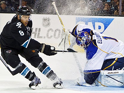 Joe Pavelski tries to score during the second period for the Sharks, but the Blues' Brian Elliott is up to the task. (US Presswire)
