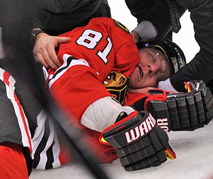 Marian Hossa is knocked out of the game after taking a big hit from Raffi Torres in the first period.  (US Presswire)
